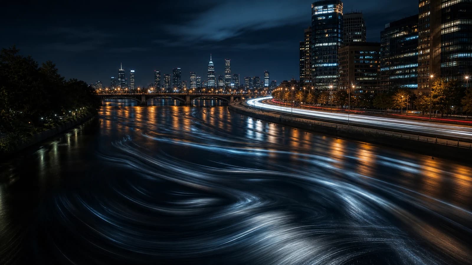 A long-exposure river and city light-trail scene at night, used as a metaphor for continuous event streams, velocity, and real-time signal detection.